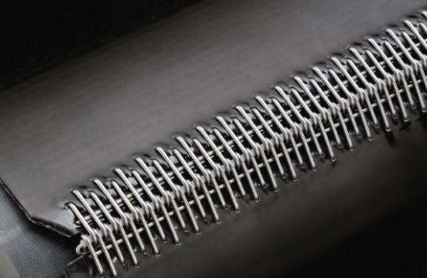 Stainless steel mechanical wire hook lacing fastener joint on industrial conveyor belt by Nova Beltech