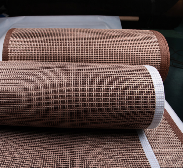 Rolled PTFE open mesh conveyor belts with Kevlar and PTFE edge reinforcements by Nova Beltech