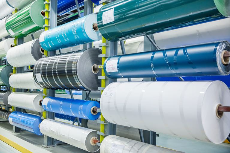 Large warehouse inventory stock of industrial conveyor belting rolls at Nova Beltech warehouse