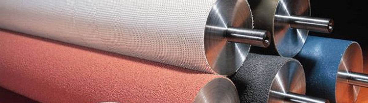 Industrial drive rollers wrapped in custom rubber, silicone, and polyurethane roller coverings by Nova Beltech
