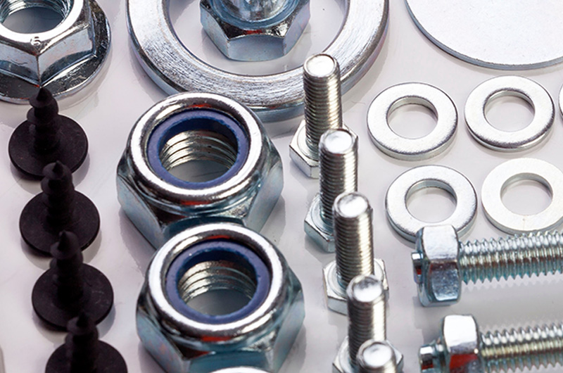 Industrial MRO hardware fasteners including hex bolts, nylon lock nuts, and washers by Nova Beltech